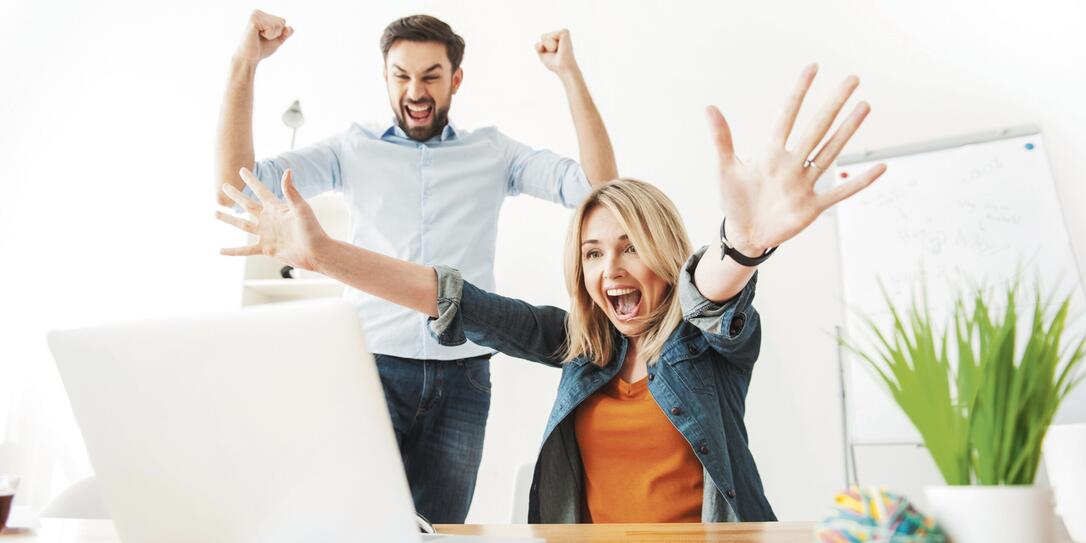 Cheerful young office workers are expressing happiness Cheerful young office workers are expressing happiness